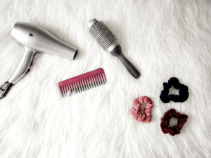 blow dryer, hair brush, and hair scrunchies